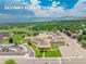 Aerial view of Devinny Elementary School, a neighborhood school with playgrounds and parking at 1811 S Yank Ct, Lakewood, CO 80228