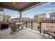 Cozy covered patio with stylish outdoor furniture, perfect for enjoying the serene backyard view at 3022 Merlin Dr, Brighton, CO 80601