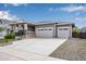 Charming single-story home with a well-manicured lawn and a two-car garage at 3022 Merlin Dr, Brighton, CO 80601