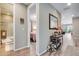 Hallway showcases connections to a bathroom, bedroom, and living room with tasteful decor at 3022 Merlin Dr, Brighton, CO 80601