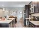 Well-appointed kitchen with stainless steel appliances, plenty of storage, and a seamless connection to the dining area at 3022 Merlin Dr, Brighton, CO 80601