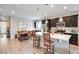 Contemporary kitchen with a center island, stainless appliances, and open layout ideal for entertaining guests at 3022 Merlin Dr, Brighton, CO 80601