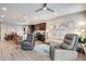 Inviting living area with modern decor, a comfortable seating arrangement, and seamless flow to the kitchen at 3022 Merlin Dr, Brighton, CO 80601