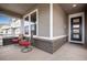 Inviting front porch with comfortable seating perfect for relaxing and enjoying the outdoors at 3022 Merlin Dr, Brighton, CO 80601