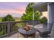 Outdoor deck with fire pit and comfortable seating. Perfect for evenings outdoors with stunning views at 15502 E Flower Mound Pl, Parker, CO 80134