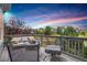 Beautiful back deck with comfortable seating and fire pit, perfect for evening relaxation and views at 15502 E Flower Mound Pl, Parker, CO 80134