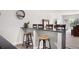 Finished basement with bar, stools, and mirror, perfect for entertaining guests at 15502 E Flower Mound Pl, Parker, CO 80134