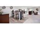 Finished basement showcasing bar area with seating, and open living space with tv at 15502 E Flower Mound Pl, Parker, CO 80134