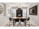 Elegant dining room features modern decor, stylish furniture, and contemporary lighting at 15502 E Flower Mound Pl, Parker, CO 80134
