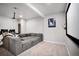 Spacious living room with projector, large screen, and sectional sofa is perfect for Gathering movie nights at 15502 E Flower Mound Pl, Parker, CO 80134