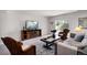 Basement living room with comfortable seating and bright natural light at 15502 E Flower Mound Pl, Parker, CO 80134