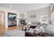 Spacious living room with a cozy fireplace and ample seating with open floor plan at 15502 E Flower Mound Pl, Parker, CO 80134