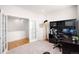 Bright office features a built-in desk, neutral carpet, and a serene workspace at 15502 E Flower Mound Pl, Parker, CO 80134