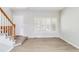 Bright entryway featuring wood floors, a staircase and an abundance of natural light at 1526 Braewood Ave, Littleton, CO 80129