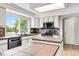 Well-lit kitchen showcases modern appliances, a stylish backsplash, island, and a bright window at 1526 Braewood Ave, Littleton, CO 80129