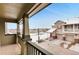 Private balcony with views of neighboring homes and snow covered landscaping in winter at 12914 Grant Cir # C, Thornton, CO 80241