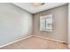 Bedroom with neutral walls, carpet flooring, and a window at 12914 Grant Cir # C, Thornton, CO 80241
