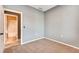Neutral bedroom with plush carpet and attached bathroom with a shower and bath at 12914 Grant Cir # C, Thornton, CO 80241