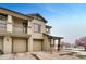 Inviting townhome with attached garages, stone accents, and manicured landscaping, offering convenience and curb appeal at 12914 Grant Cir # C, Thornton, CO 80241