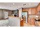 Bright kitchen with stainless steel appliances, generous counter space, and seamless flow into the dining area at 12914 Grant Cir # C, Thornton, CO 80241