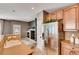 Modern kitchen featuring stainless steel appliances, tile flooring, and ample cabinet space at 12914 Grant Cir # C, Thornton, CO 80241
