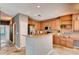 Well-equipped kitchen with stainless steel appliances, wood cabinets, and a breakfast bar, perfect for casual dining at 12914 Grant Cir # C, Thornton, CO 80241