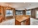 Charming kitchen with island and lots of natural lighting with an open concept floorplan to the living room at 12914 Grant Cir # C, Thornton, CO 80241