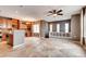 Spacious living room seamlessly connects to the kitchen with built-in shelves, providing ample storage and display space at 12914 Grant Cir # C, Thornton, CO 80241