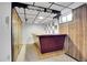 Finished basement wet bar with hardwood accents and retro design at 8005 Emerald Ln, Broomfield, CO 80020