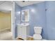 Finished basement bathroom with white fixtures and blue walls at 8005 Emerald Ln, Broomfield, CO 80020