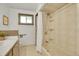 Bright bathroom with updated fixtures, tiled shower-tub, and ample counter space at 8005 Emerald Ln, Broomfield, CO 80020