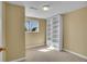 Finished basement bedroom with window, carpeted floor and built-in bookcase at 8005 Emerald Ln, Broomfield, CO 80020