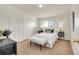 Bright bedroom with a large window, white bedding, and plush accents at 8005 Emerald Ln, Broomfield, CO 80020