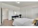 Well-lit bedroom with neutral carpet, white walls, and a storage closet at 8005 Emerald Ln, Broomfield, CO 80020