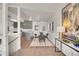 View of the dining room leading to the kitchen, with modern decor and ample space at 8005 Emerald Ln, Broomfield, CO 80020