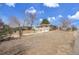 View of front yard, house, and long driveway at 8005 Emerald Ln, Broomfield, CO 80020