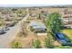 Aerial view of a single-story home featuring a flat roof, spacious yard, and mature trees in a residential neighborhood at 8005 Emerald Ln, Broomfield, CO 80020