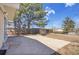 Concrete patio with mature trees and a view of the backyard at 8005 Emerald Ln, Broomfield, CO 80020