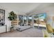Sunroom with neutral chaise lounge and sliding doors to a private outdoor space at 8005 Emerald Ln, Broomfield, CO 80020