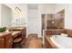 Beautiful bathroom features a separate tub and shower, and updated fixtures at 4894 Bierstadt Loop, Broomfield, CO 80023