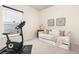 A flex bedroom featuring a daybed, exercise bike, natural light, and neutral color palette at 4894 Bierstadt Loop, Broomfield, CO 80023