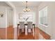Cozy dining room features a modern chandelier and natural light from the nearby window at 4894 Bierstadt Loop, Broomfield, CO 80023