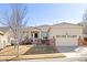 Charming single-story home featuring stucco siding, brick accents, and a well-manicured front yard at 4894 Bierstadt Loop, Broomfield, CO 80023