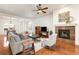 Inviting living room featuring a tiled fireplace and open layout at 4894 Bierstadt Loop, Broomfield, CO 80023