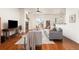 Cozy living room featuring hardwood floors, a fireplace, and sliding glass door at 4894 Bierstadt Loop, Broomfield, CO 80023