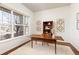 Comfortable office area with wooden desk and large window providing natural light at 4894 Bierstadt Loop, Broomfield, CO 80023