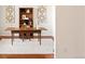 Bright office offers a wooden desk with bookshelf and soft rug at 4894 Bierstadt Loop, Broomfield, CO 80023