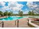 Outdoor community pool and hot tub featuring a sprawling deck and mountain views at 4894 Bierstadt Loop, Broomfield, CO 80023