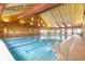 Indoor community pool featuring high ceilings, natatorium design, and ample sunlight at 4894 Bierstadt Loop, Broomfield, CO 80023