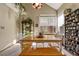 Bright dining room with wood table and built-in shelving at 2134 S Scranton Way, Aurora, CO 80014